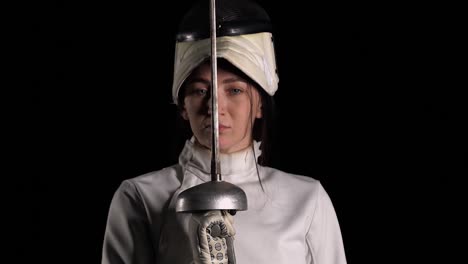 female fencer in foil ready position