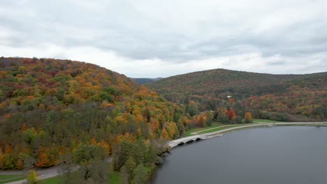 cloudy skies over red house lake at allegheny state park, new york state
