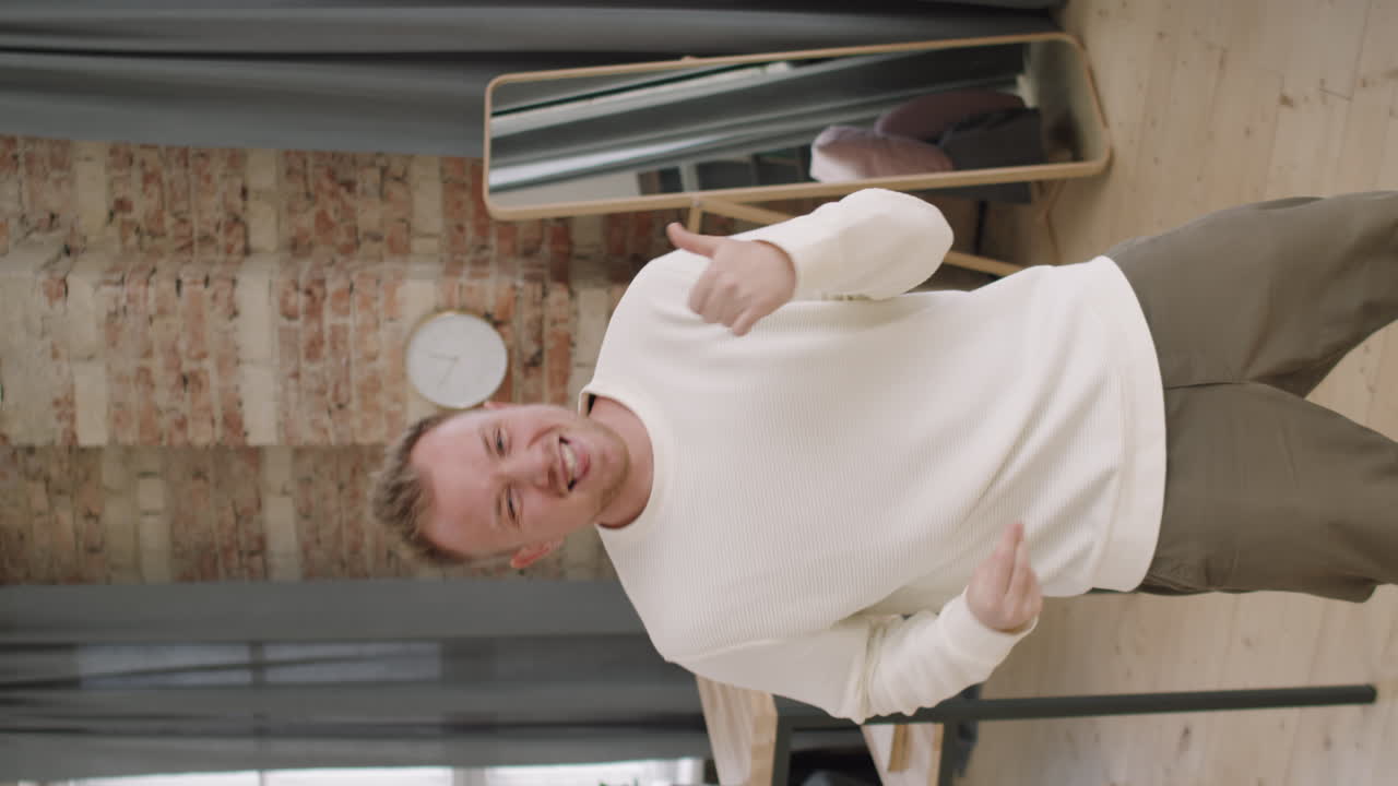 Man Improvising to Music before Camera