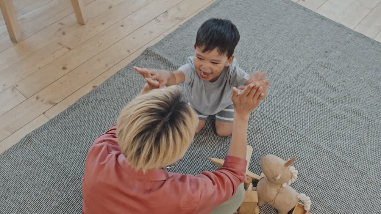 Mom and Son Playing Pat-A-Cake Game