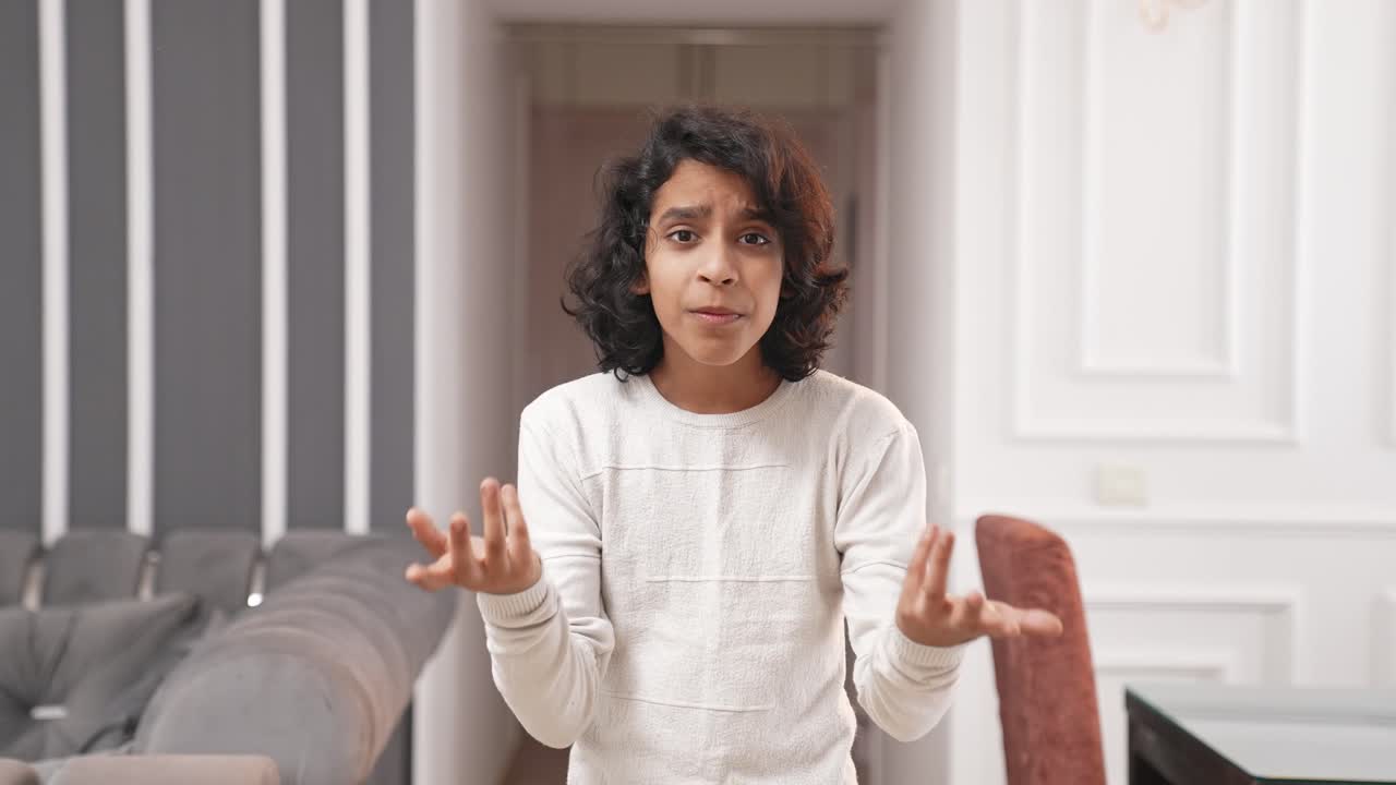 Frustrated Indian kid asking questions to someone