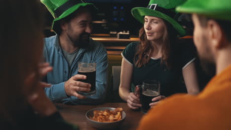 men and women in irish hats celebrating saint patrick's day