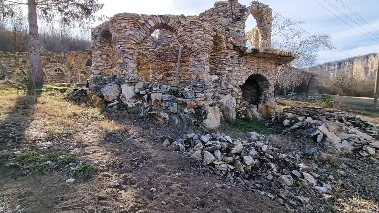 Abandoned and damaged stone house in nature