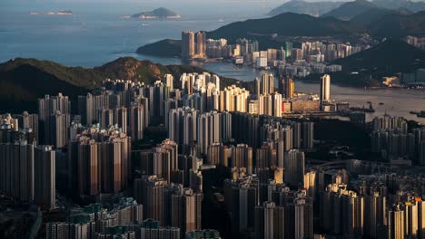 Full-wide-view-of-Kowloon,-Hong-Kong-with-modern-skyline-office,-condo,-mountain-and-beach