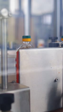bottles with fresh oil. conveyor line for bottling and packing vertical video