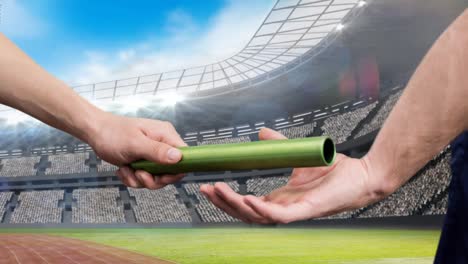 Animation-of-athlete's-hands-passing-relay-baton-over-sports-stadium