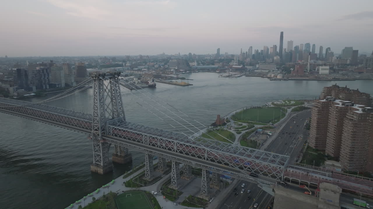 Aerial view of the Williamsburg Bridge and the East River on an overcast day