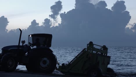 Beach-rake-machine-at-twilight.-Lockdown-footage