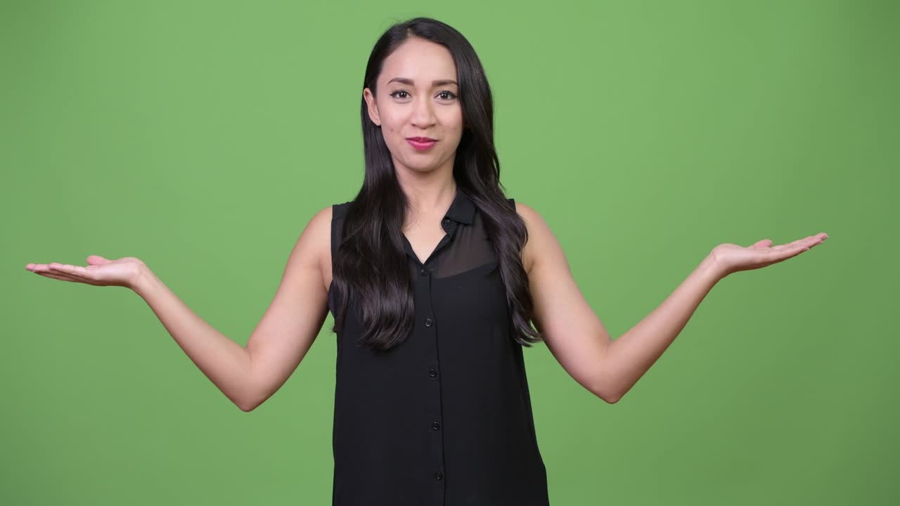 Young beautiful Asian businesswoman choosing between left and right