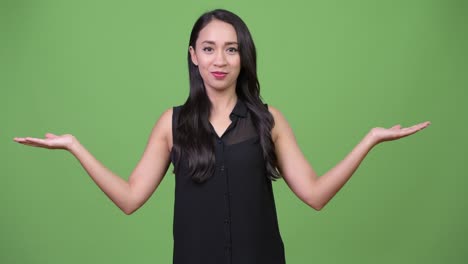 young beautiful asian businesswoman choosing between left and right