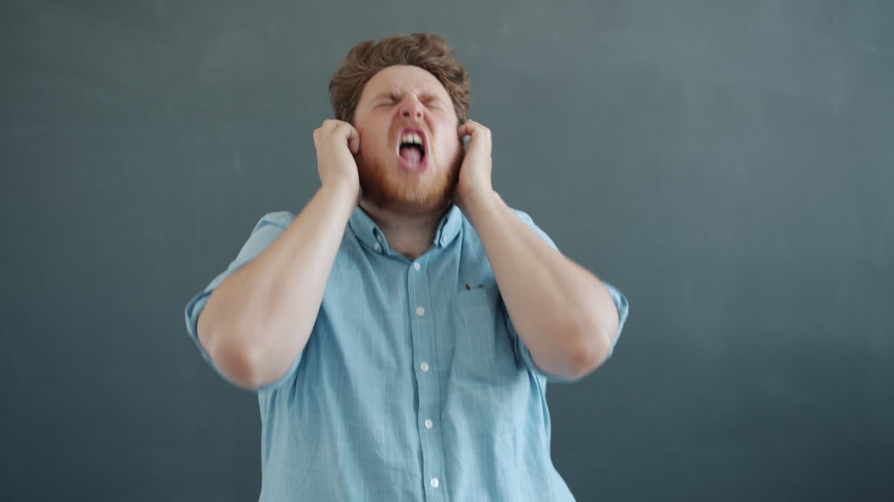 Man Singing Along to Music with Headphones