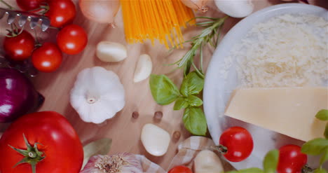 fresh food ingredients on wooden table in kitchen