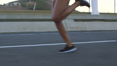 woman running on a city bridge