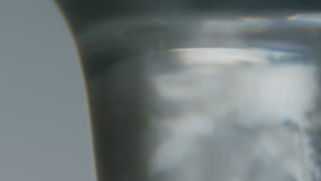 White-transparent-fluid-with-small-crystals-inside-dripping-slowly