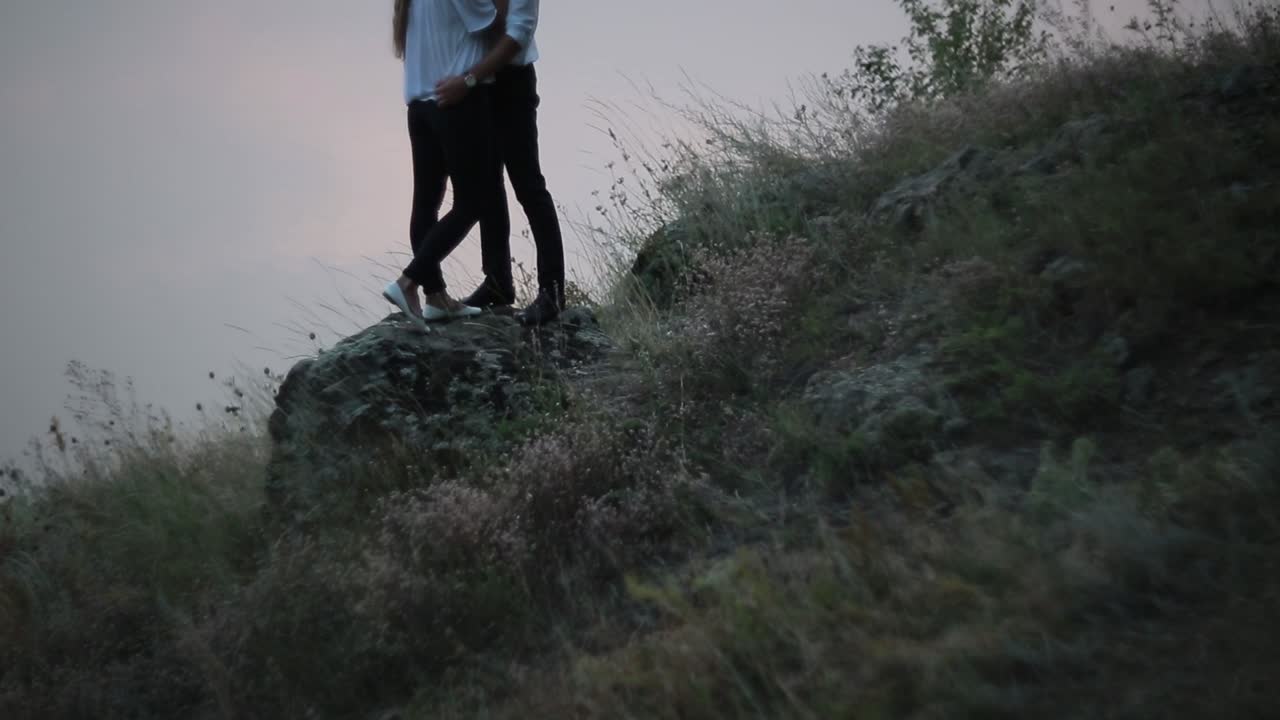 Happy Couple Enjoying On River Bank. Happy caucasian couple looking with love and tenderness