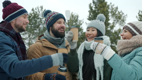 friends enjoying coffee outdoors in the winter