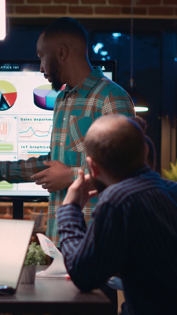Vertical video: African american employee giving analytics presentation in business meeting