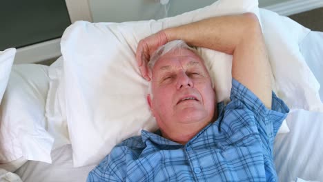Senior-woman-blocking-out-his-husband-snoring