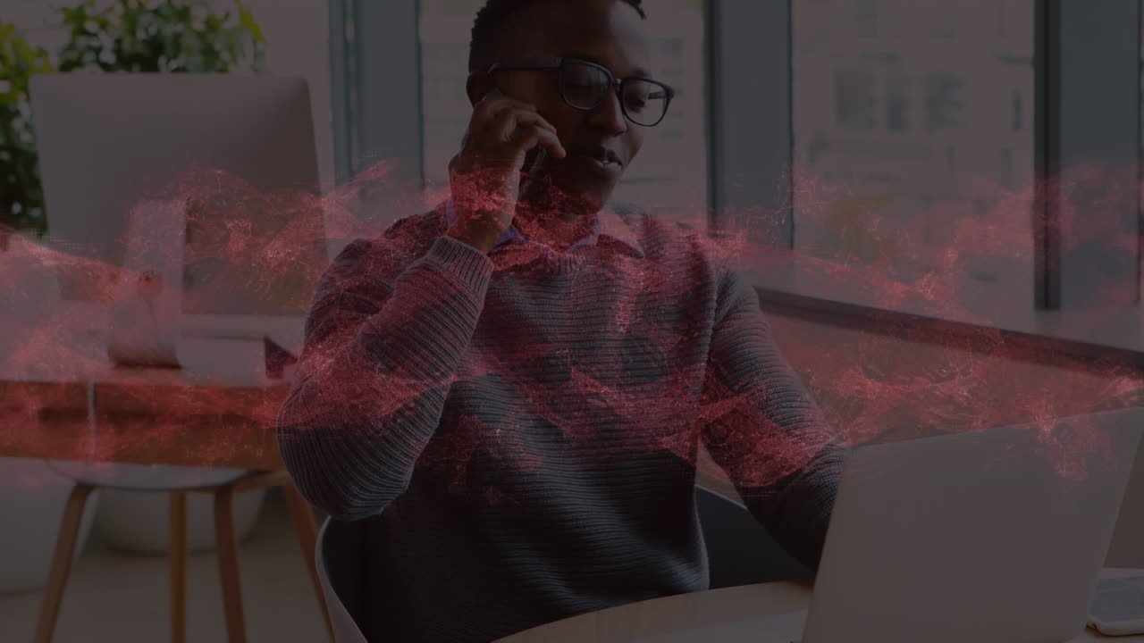 Animation of red waves over businessman in office