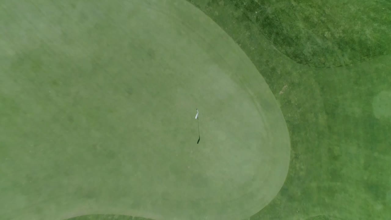 Aerial shot of golf green fly in