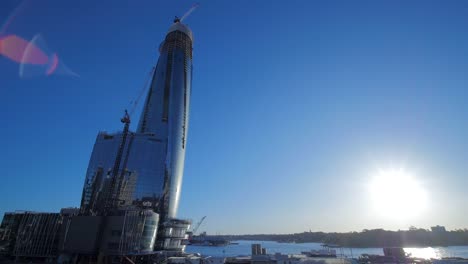 skyscraper under construction on waterfront