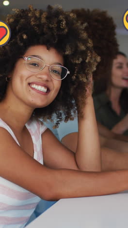 animation of heart icons over happy diverse friends drinking beer