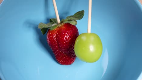 strawberry, banana, and grape on skewers