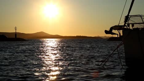 Boats-and-yachts-enter-and-exit-marina-at-sunset-in-Biograd-in-Croatia