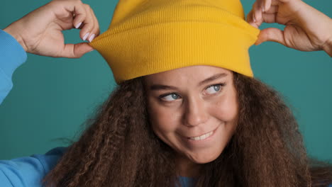 caucasian curly haired woman wearing winter clothes.