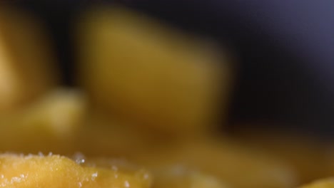 macro-close-up-shot-of-frozen-mango-cubes-in-kitchen