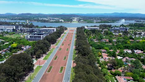 Drone-aerial-landscape-city-CBD-shot-Parliament-house-road-street-park-cars-lake-fountain-residential-commercial-buildings-landmark-tourism-travel-politics-ACT-Canberra-Australia-4K