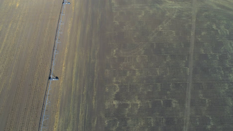 aerial view of power plant and harvested field 4k