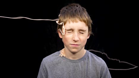 slow motion of boy getting hit with spray string
