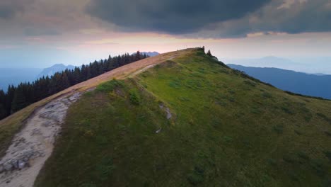 Experience-the-awe-inspiring-beauty-of-a-summer-mountain-ridge-at-sunset,-adorned-with-breathtaking-colors-that-paint-the-horizon