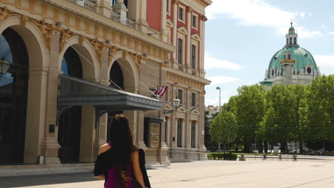 Asian-Girl-walking-towards-Musikverein-in-Vienna,-Slow-Motion