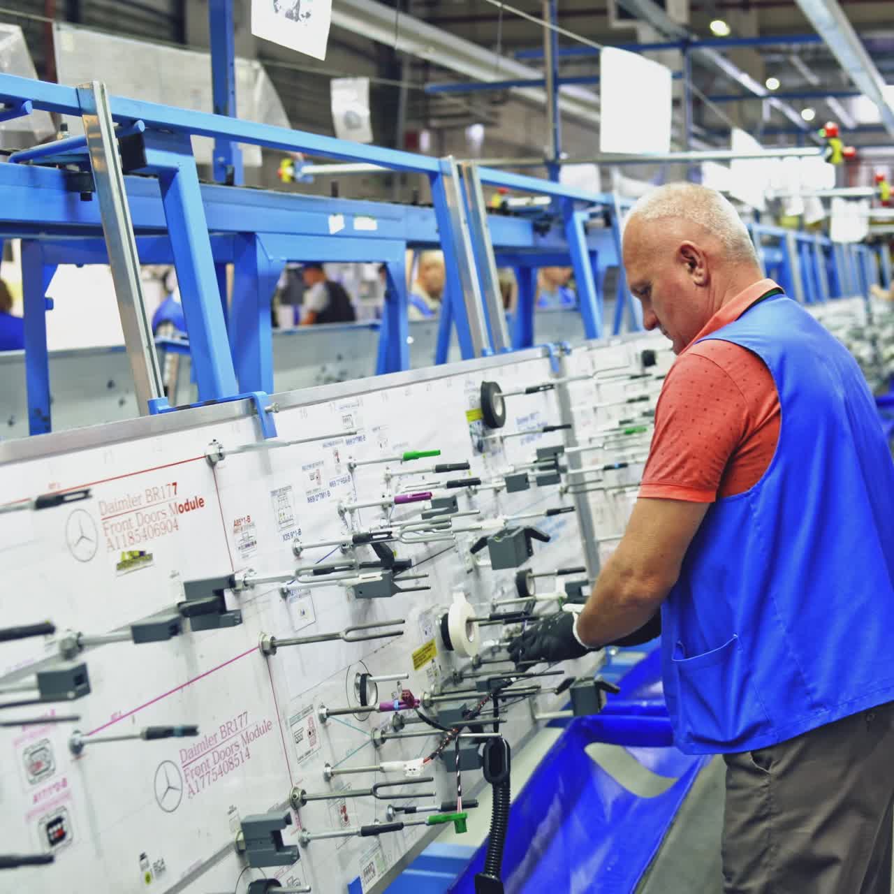 Workers team working at wire factory
