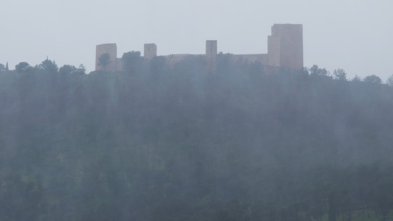 Santa Catalina Castle in Jaén during a storm