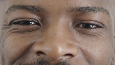 close up african american man eyes winking smiling looking happy expression