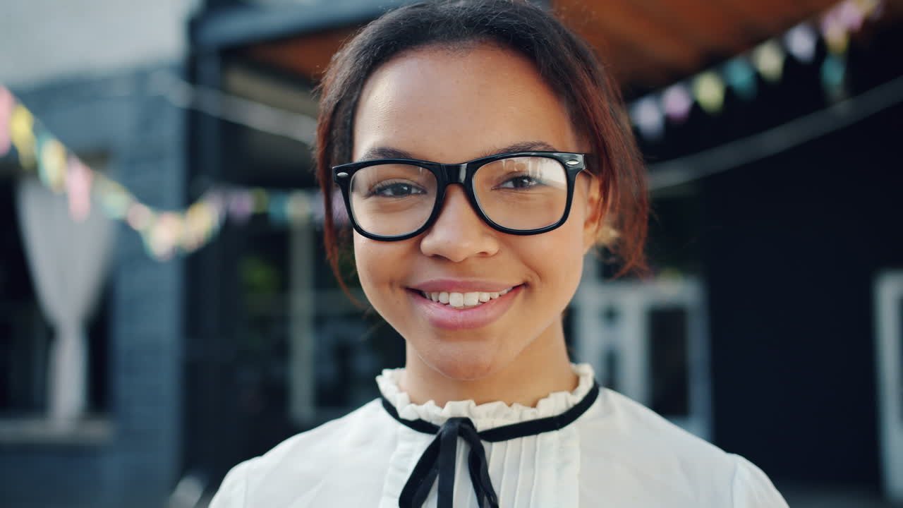 Smiling young woman wearing glasses