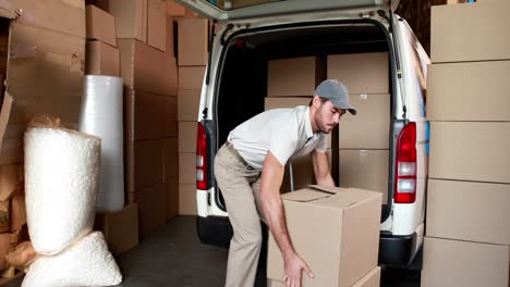 delivery driver packing his van