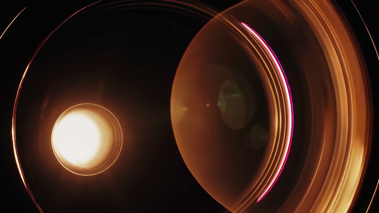 Close-up of a camera lens with light flares