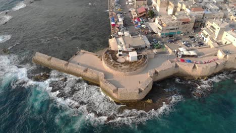 aerial footage over the old city of acre and the mediterranean sea