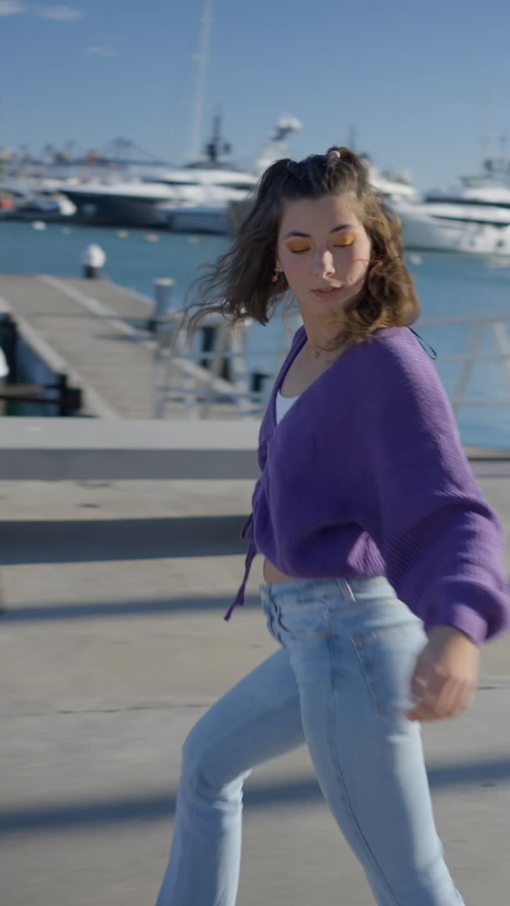 Young Woman Walking and Posing on a Sunny Pier