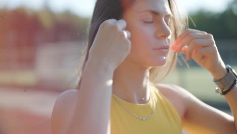 woman jogging on outdoor track in sportswear at athletic field