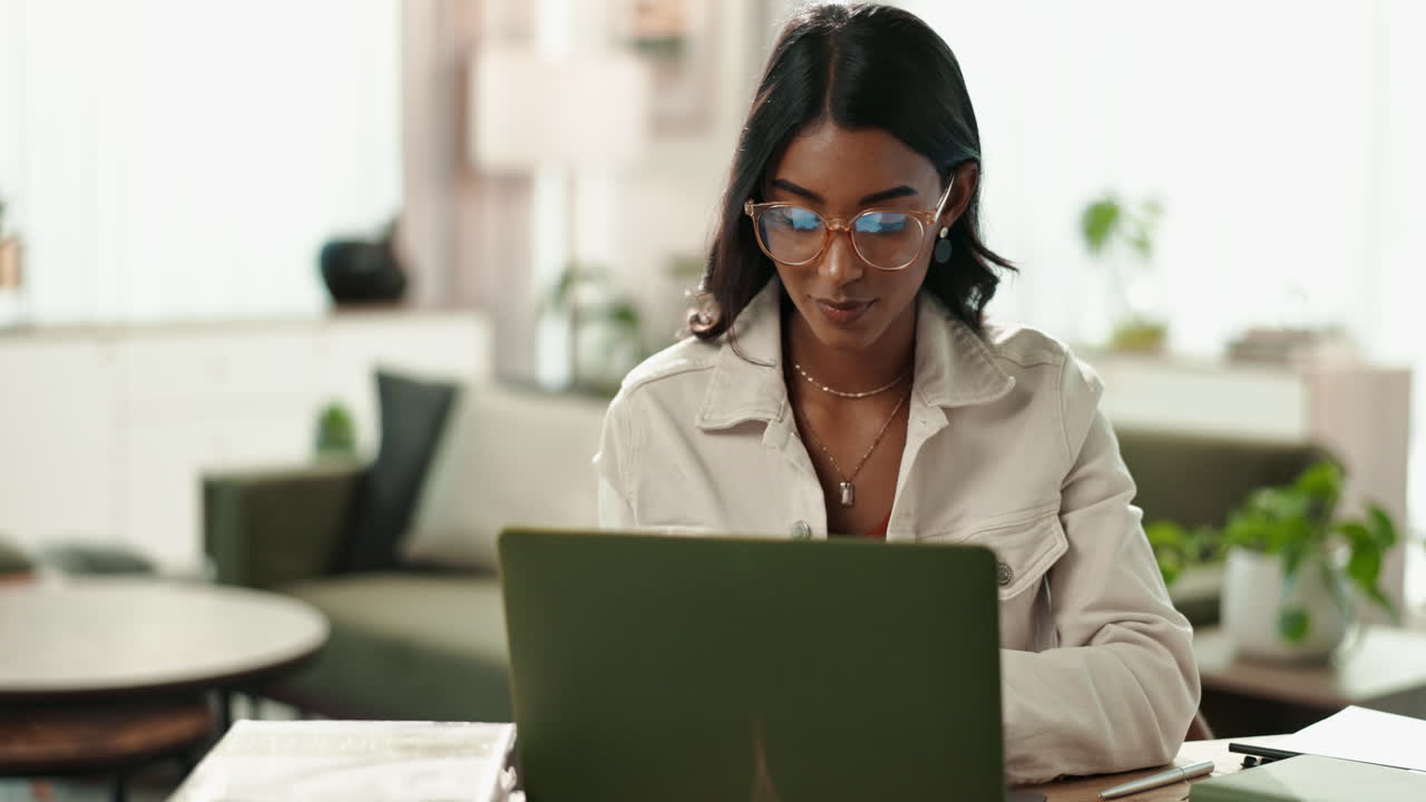 Woman working on laptop at home