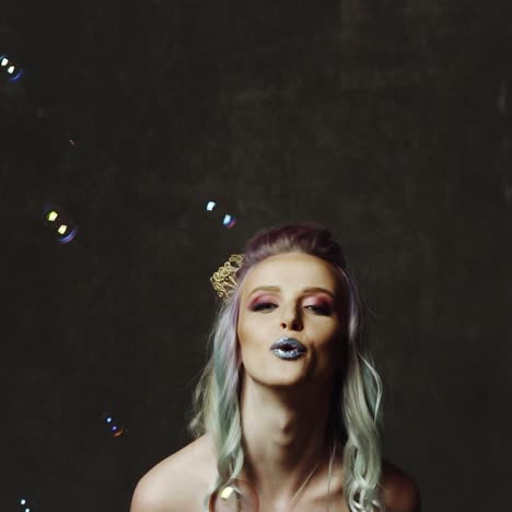 woman with soap bubbles in studio