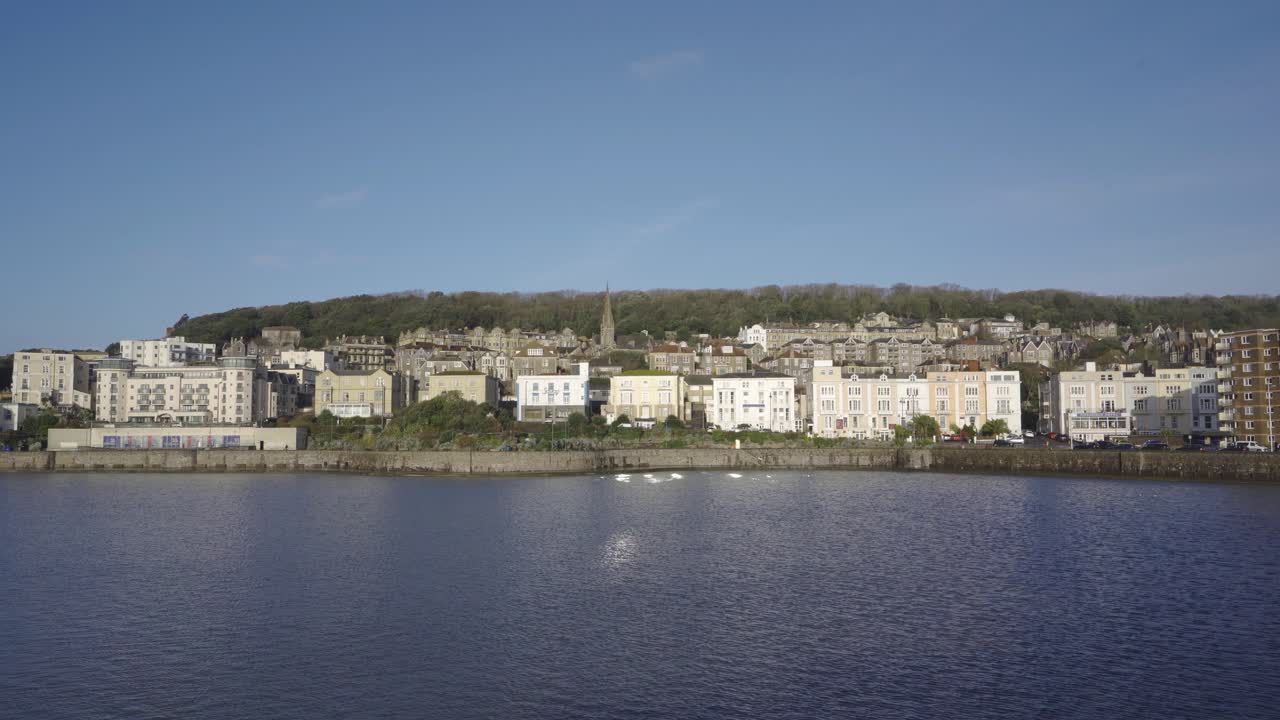 WESTON SUPER MARE, SOMERSET, ENGLAND, December 23, 2019: Marine lake built in nineteen twenty seven to facilitate bathing at low tide. Weston super mare seafront on the background.