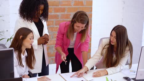 Smiling-diverse-colleagues-working-in-office