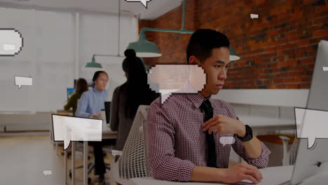 animation of floating speech bubbles over asian businessman using laptop at office