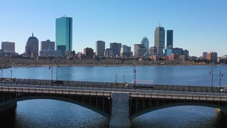 aerial establishing city skyline of boston massachusetts with longfellow bridge and vehicle traffic crossing